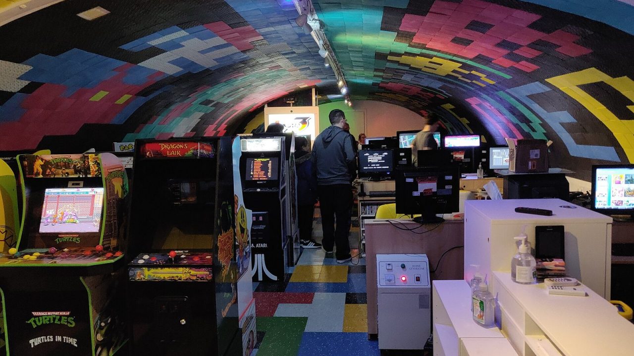 Interior of a retro video game shop with shelves of consoles and games