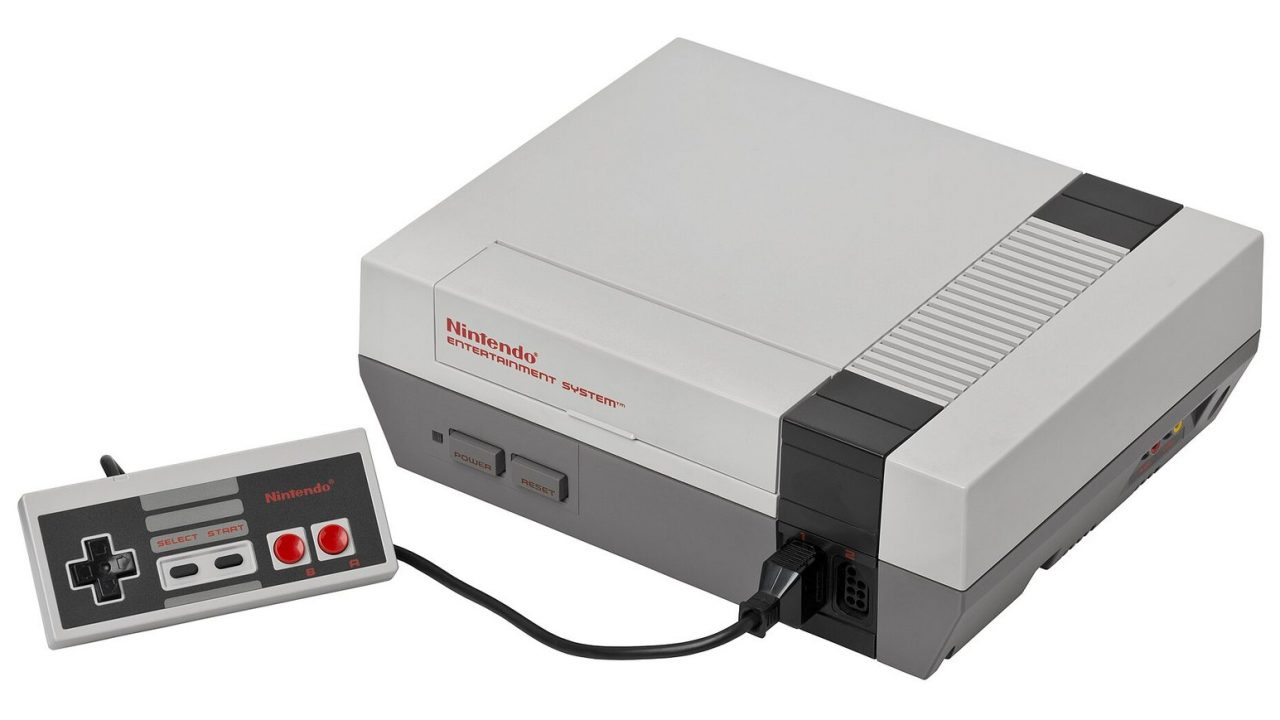 Grey front-loading Nintendo Entertainment System with a controller attached