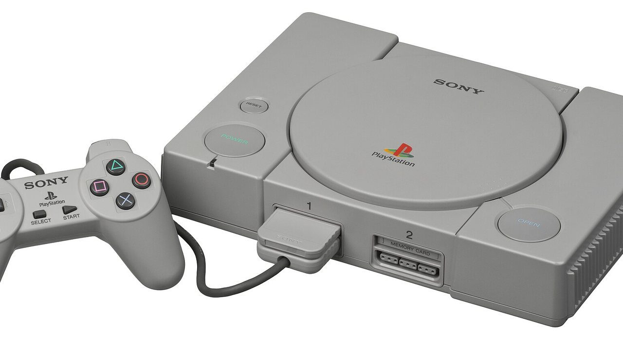 Grey Japanese PlayStation SCPH-1000 with controller and memory card