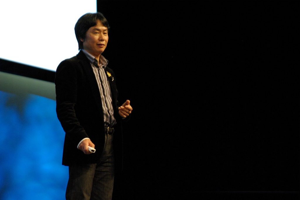 Shigeru Miyamoto speaking on stage at the Game Developers Conference