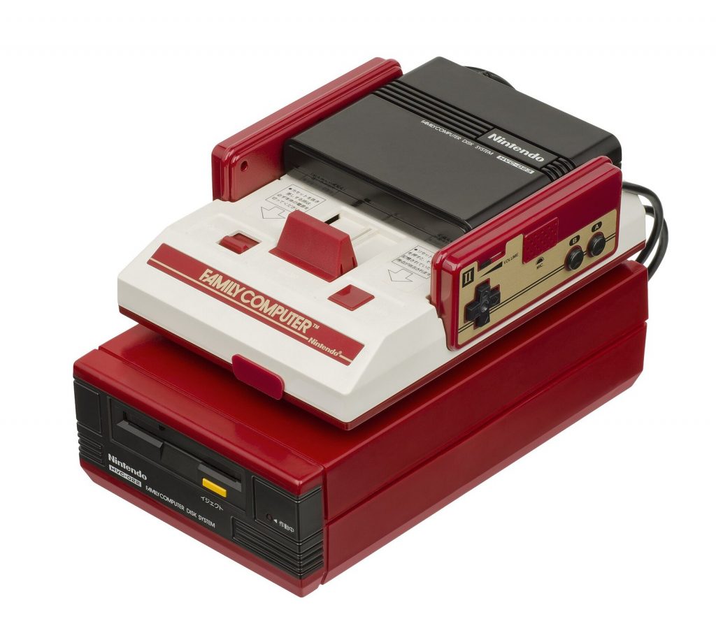 Japanese Famicom console sitting on the Famicom Disk System add-on